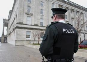 An officer of the Police Service of Northern Ireland--successor to the Royal Ulster Constabulary--on patrol outside the parliament building